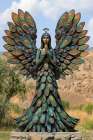 Statue of woman with feather-type wings and dress Art Print